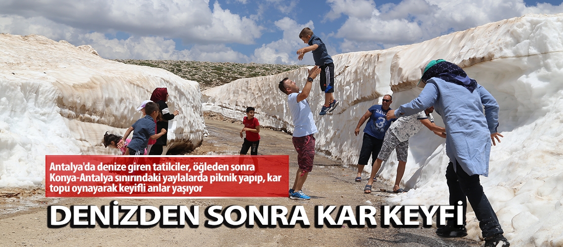 Denizden çıkıp kar topu oynadılar